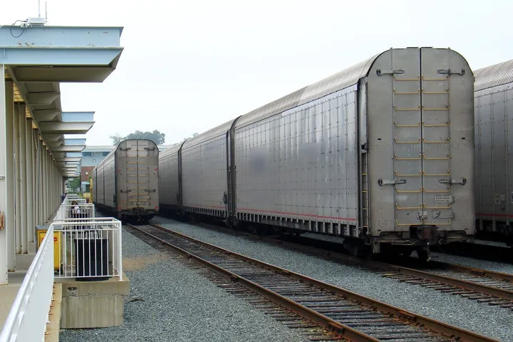 Amtrak Auto Train rail cars that carry passengers' vehicles, lined up beside the Lorton, Virginia station platform