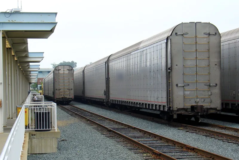 Amtrak Auto Train rail cars that carry passengers' vehicles, lined up beside the Lorton, Virginia station platform