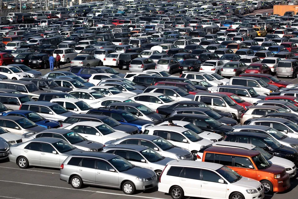 Rows of used cars in a vehicle auction yard